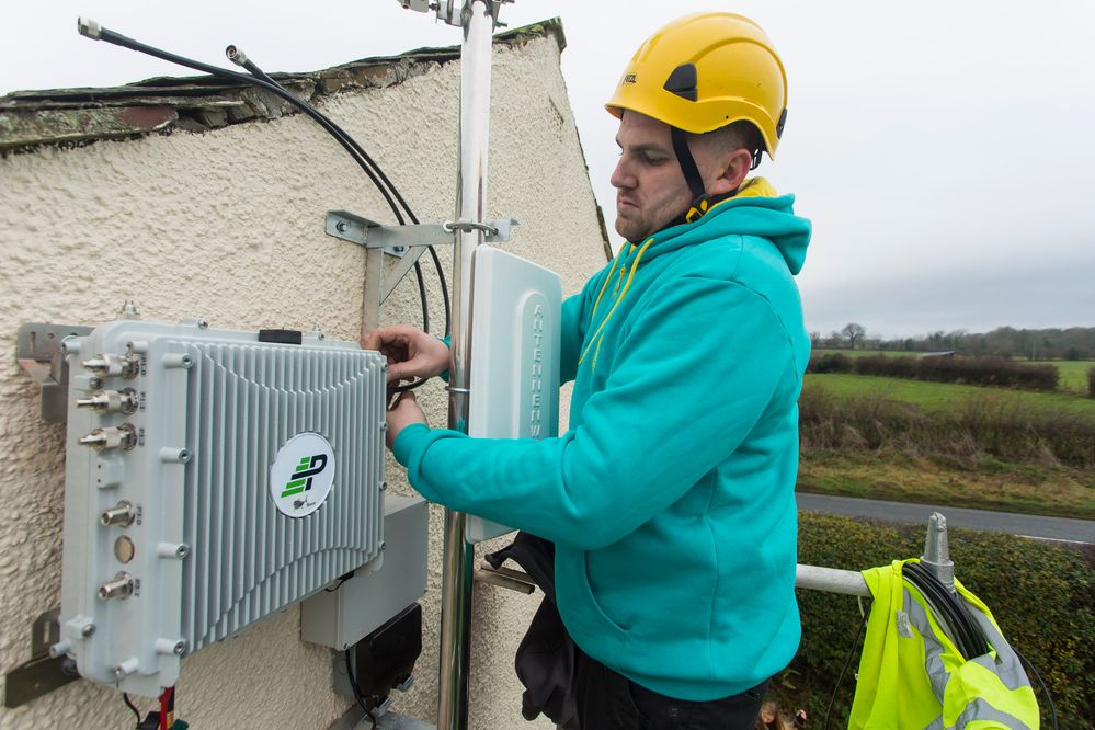 Paul Graham installs the first EE micro network site in Sebergham.JPG Paul Graham installs the first EE micro network site in Sebergham.JPG