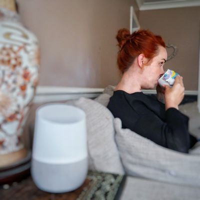 A photo of me taking full advantage of Google Home's hands-free remote capabilities.